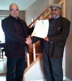 Choudhary Mureed Ahmed Sahi receives his PQS diploma from Chris Reinert